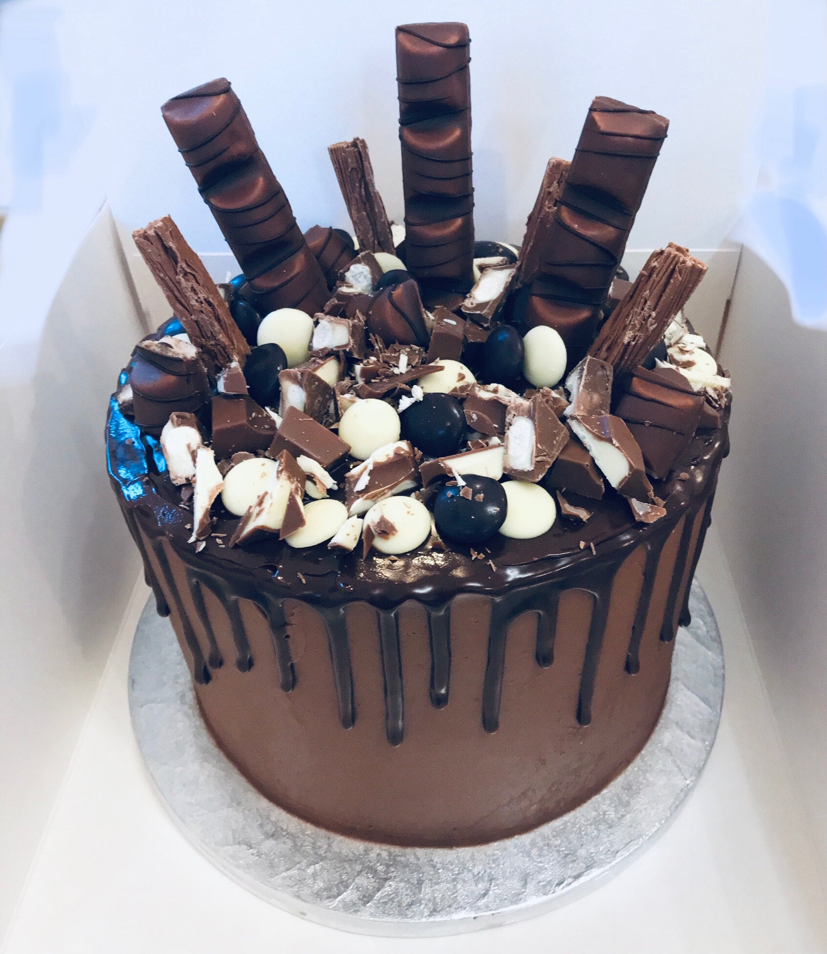 Chocolate explosion cake for a friend's birthday - first time I've been  asked to make a cake for someone! : r/cakedecorating